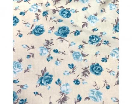 Tejido viyela fina con fondo beige y estampado de flores en tonos turquesas