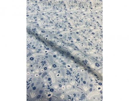 Tejido viyela fina con fondo azul y estampado de florecitas en tonos blancos y azules