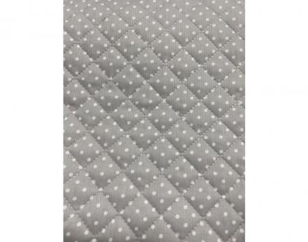 Piqué de Canutillo guateado fondo gris con topito blanco y forrado con tela fina impermeable